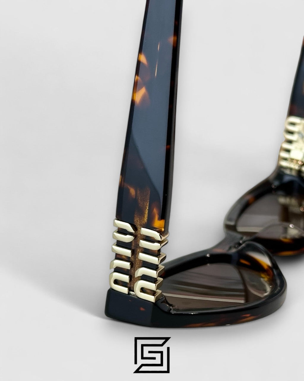 Miu Miu MUA04 14L60M Brown Lenses and Tiger Brown Frame With Gold Logo