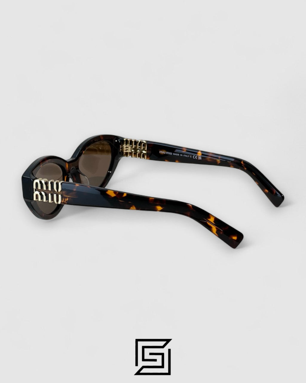 Miu Miu MUA04 14L60M Brown Lenses and Tiger Brown Frame With Gold Logo