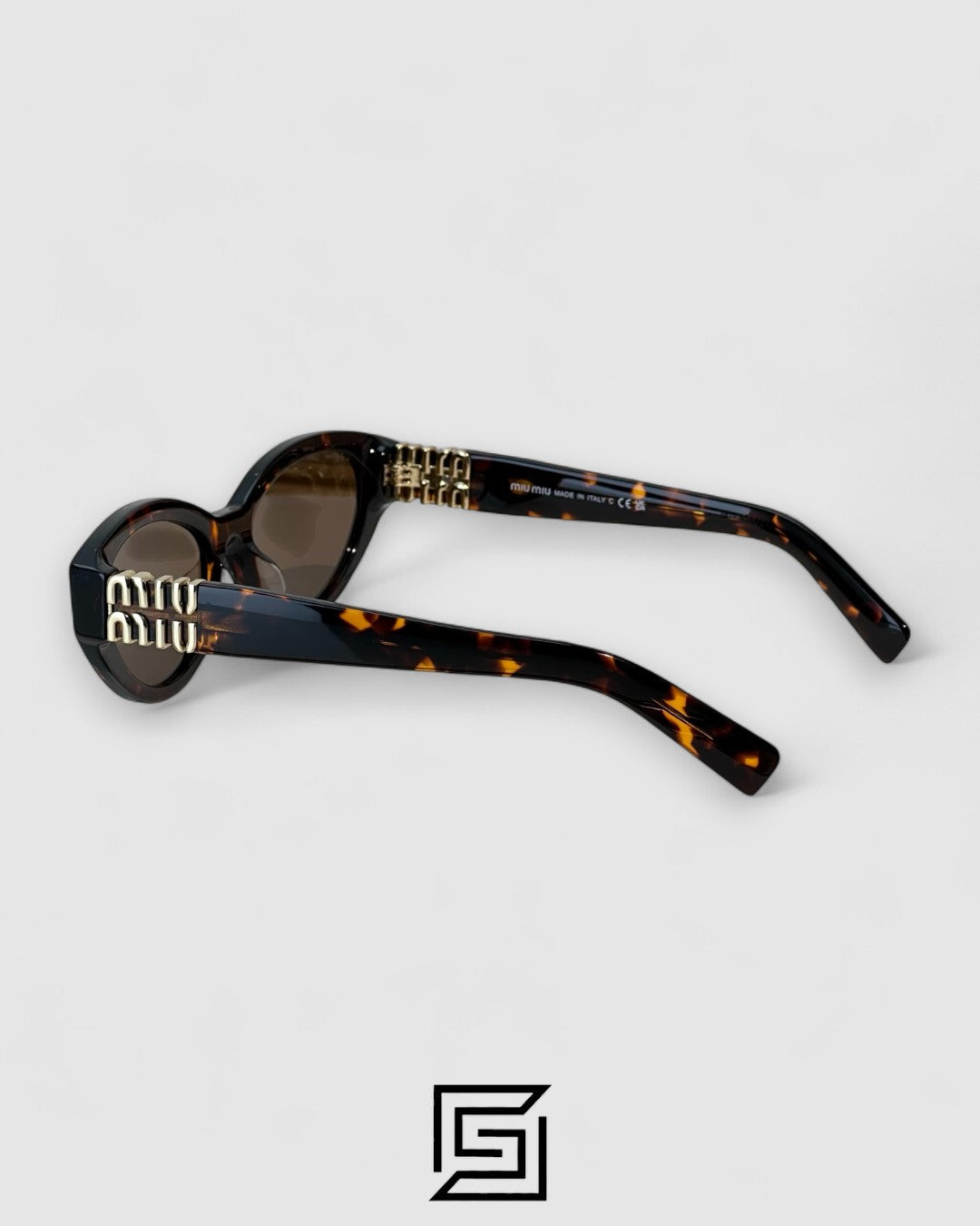 Miu Miu MUA04 14L60M Brown Lenses and Tiger Brown Frame With Gold Logo