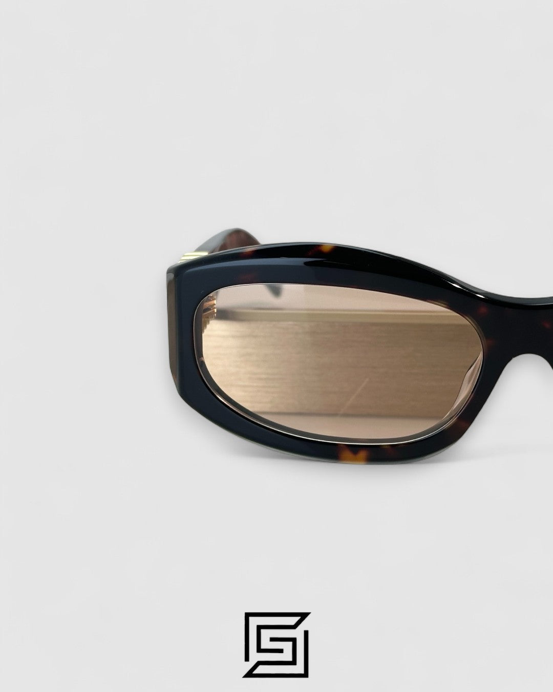 Miu Miu MU14 141-90H Light Brown Lenses and Tiger Brown Frame With Gold Logo
