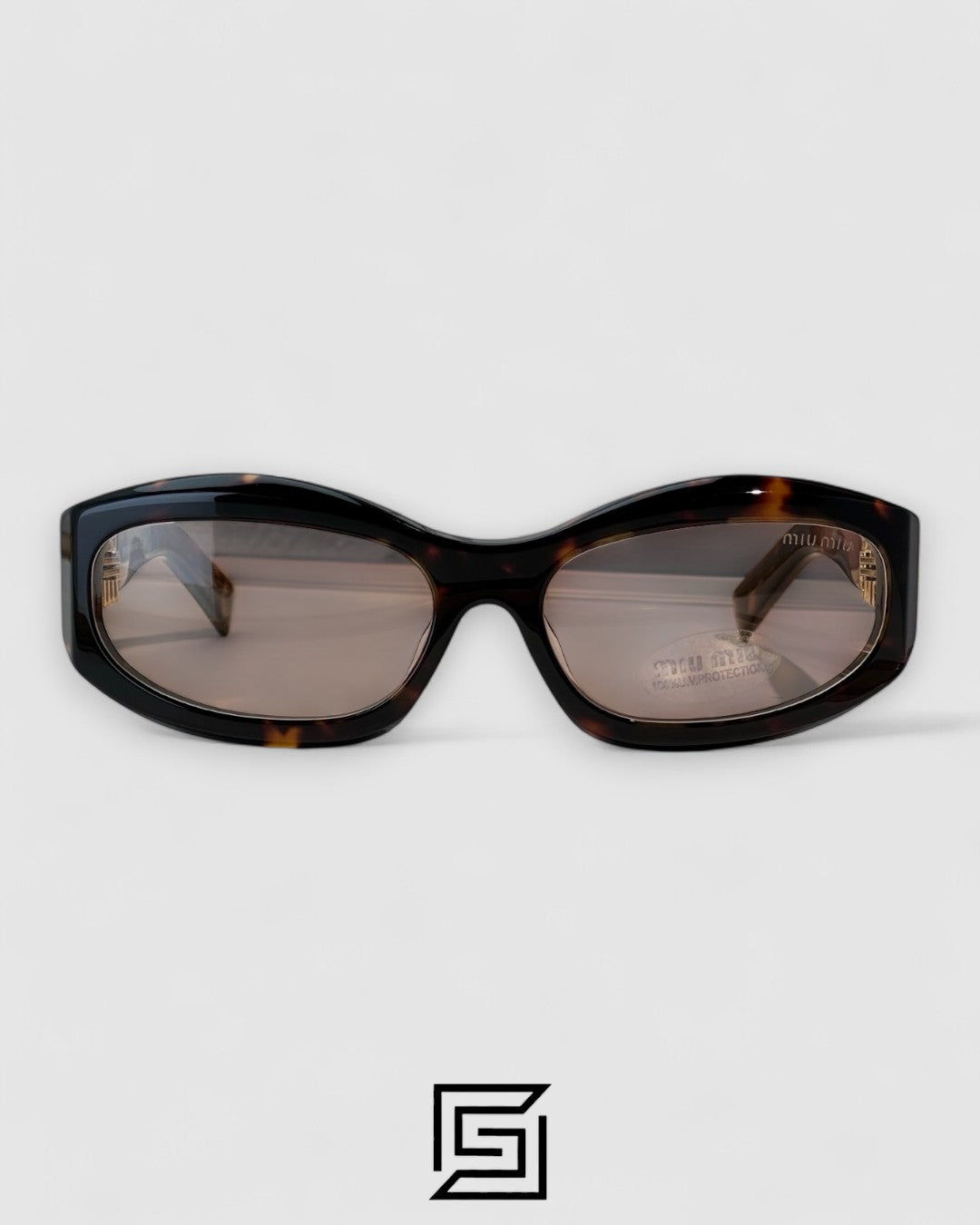Miu Miu MU14 141-90H Light Brown Lenses and Tiger Brown Frame With Gold Logo