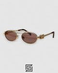 عدسات Miu Miu MU54ZS بنية وإطار ذهبي