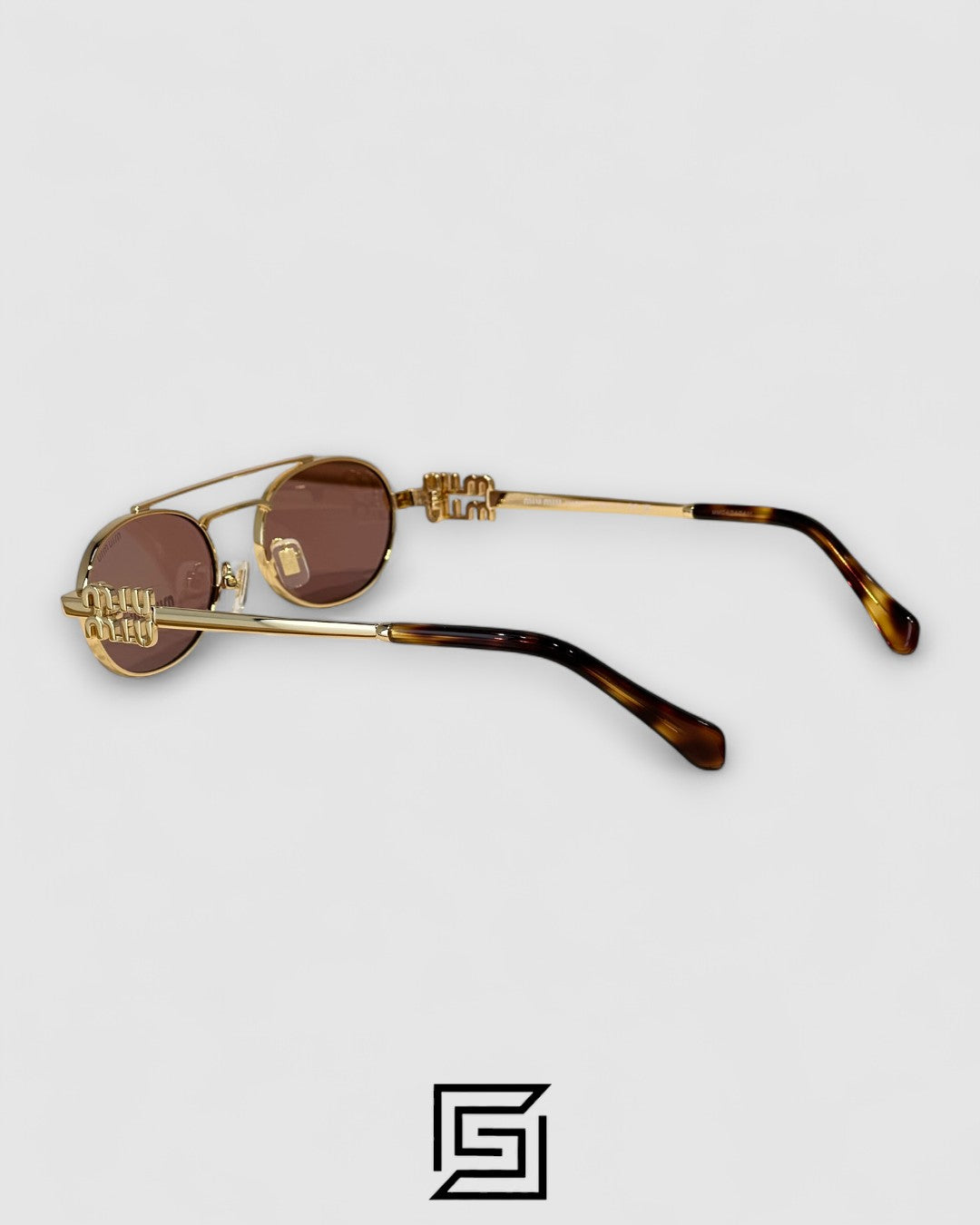 عدسات Miu Miu MU54ZS بنية وإطار ذهبي