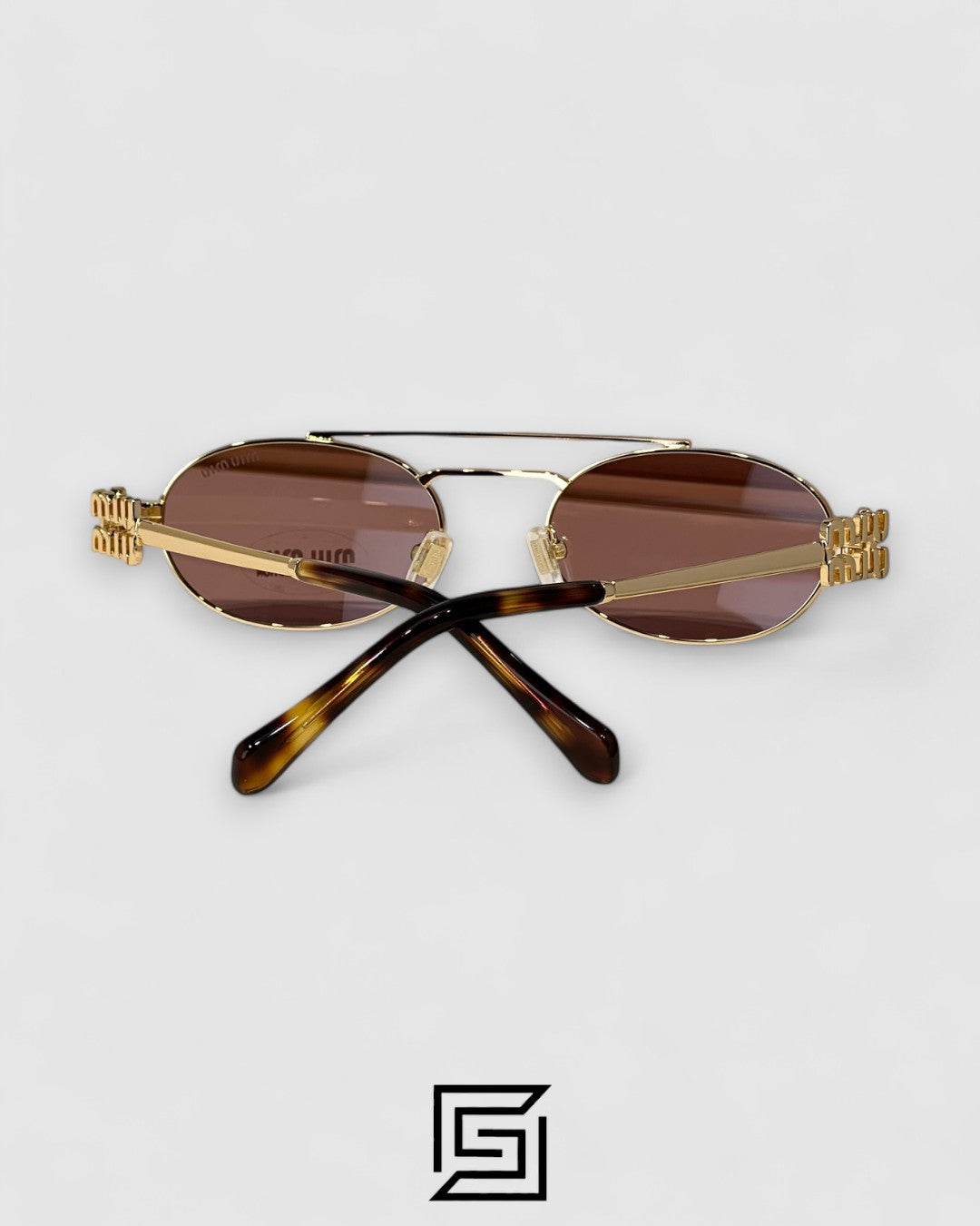 عدسات Miu Miu MU54ZS بنية وإطار ذهبي