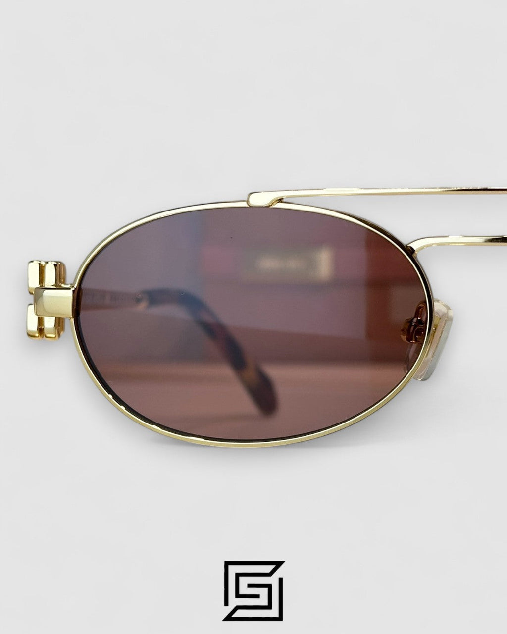 عدسات Miu Miu MU54ZS بنية وإطار ذهبي