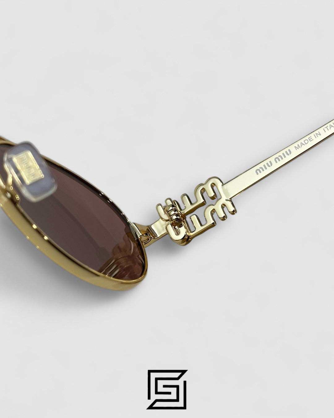 عدسات Miu Miu MU54ZS بنية وإطار ذهبي