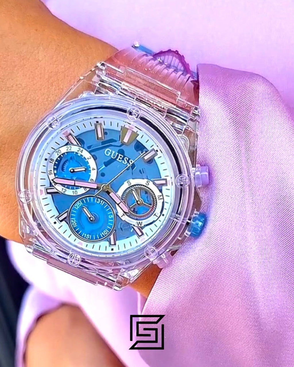 ساعة يد حريمي Guess GW0438L6 بهيكل شفاف أرجواني ومينا أزرق