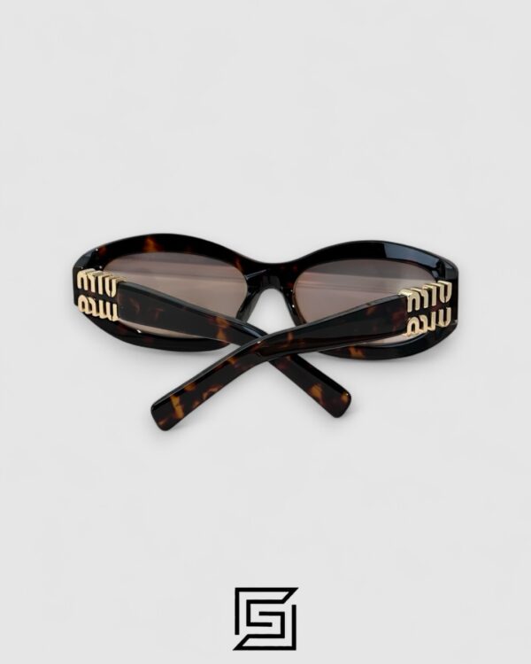 Miu Miu MU14 141-90H Light Brown Lenses and Tiger Brown Frame With Gold Logo