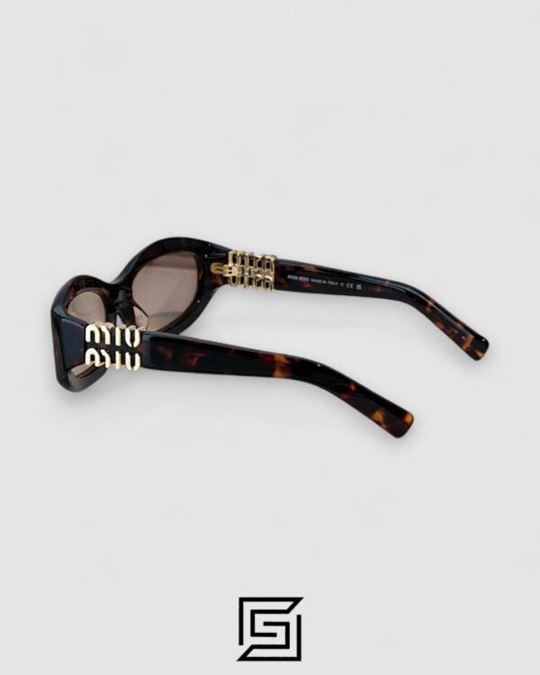 Miu Miu MU14 141-90H Light Brown Lenses and Tiger Brown Frame With Gold Logo