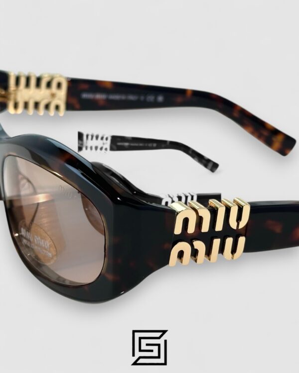 Miu Miu MU14 141-90H Light Brown Lenses and Tiger Brown Frame With Gold Logo