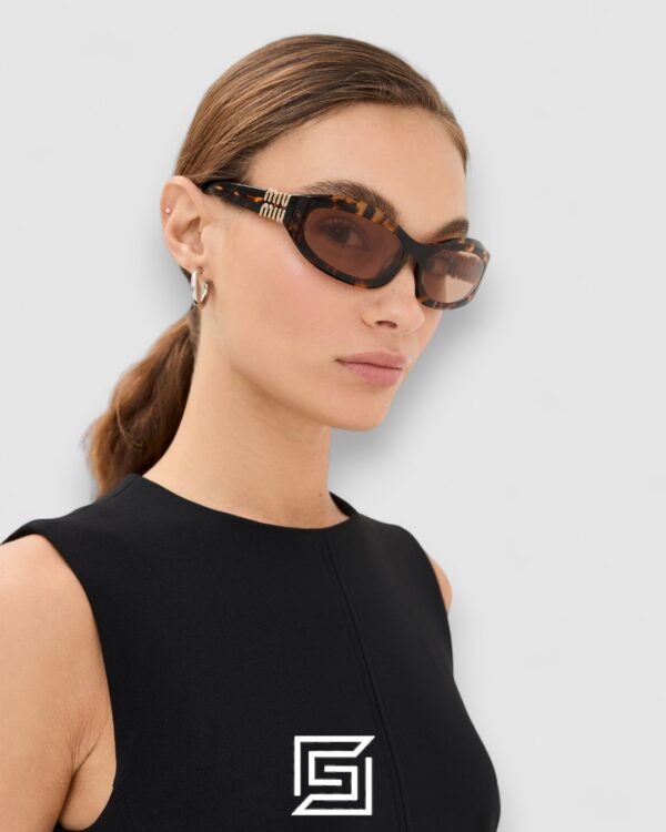 Miu Miu MU14 141-90H Light Brown Lenses and Tiger Brown Frame With Gold Logo